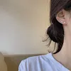 Clous d'oreilles diamant sept &eacute;toiles