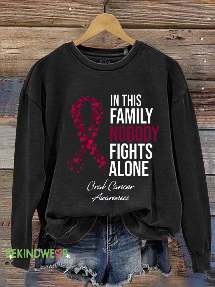 IN THIS FAMILY NOBODY FIGHTS ALONE Oral Cancer Aurreness Casual Sweatshirt Black / S