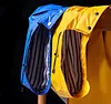 Outdoor women's waterproof long raincoat with hooded windbreaker