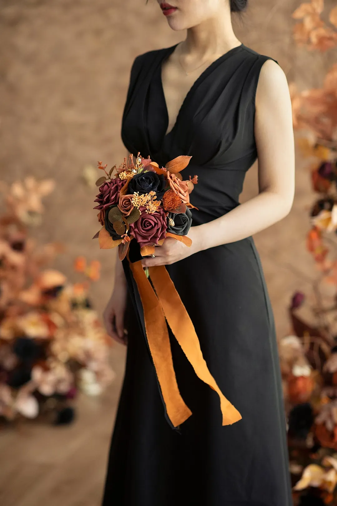 Round Bridesmaid Bouquets in Black & Pumpkin Orange