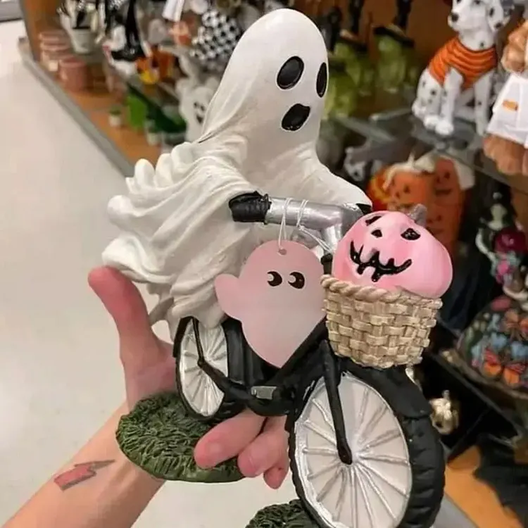 Ghost Riding a Bike with Pink Pumpkin