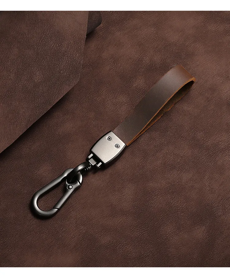 🔥Hot sale🔥Exclusive logo🔥Car anti-lost genuine leather alloy keychain