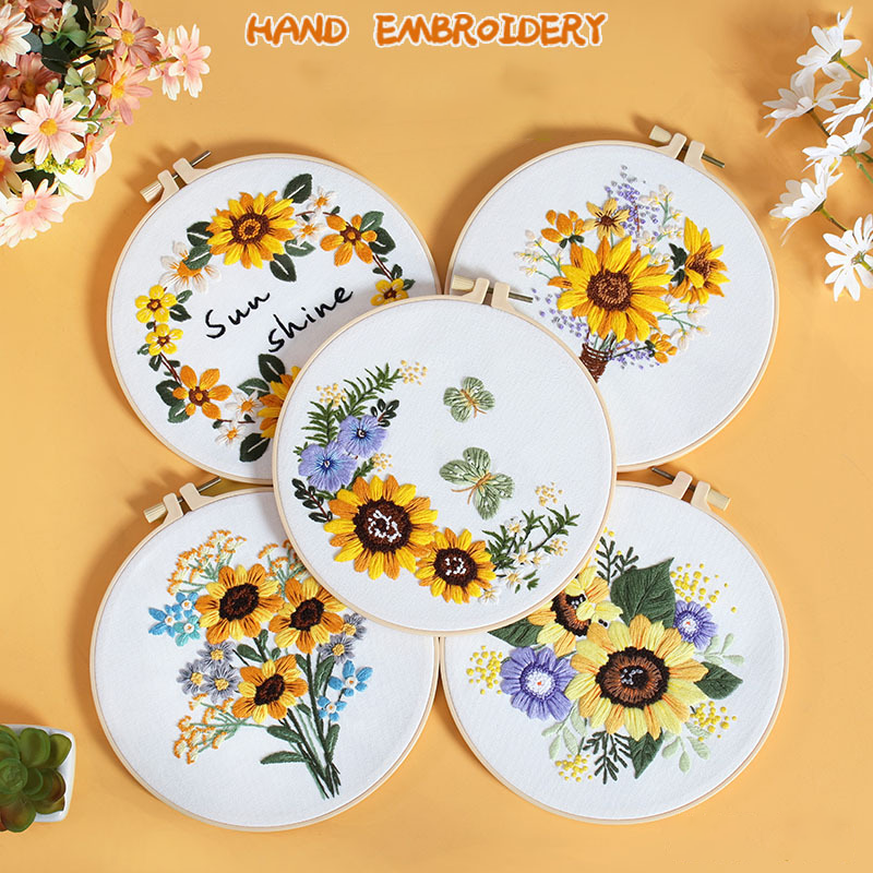 DIY sunflower embroidery kit with vibrant floral designs in embroidery hoops.