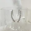 Clous d'oreilles diamant sept &eacute;toiles