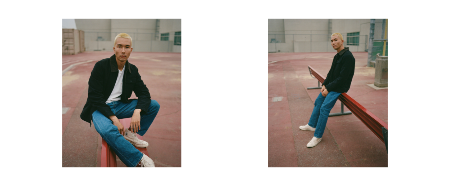 Levi's mens editorial images- man sitting wearing black lightwieght jacket
