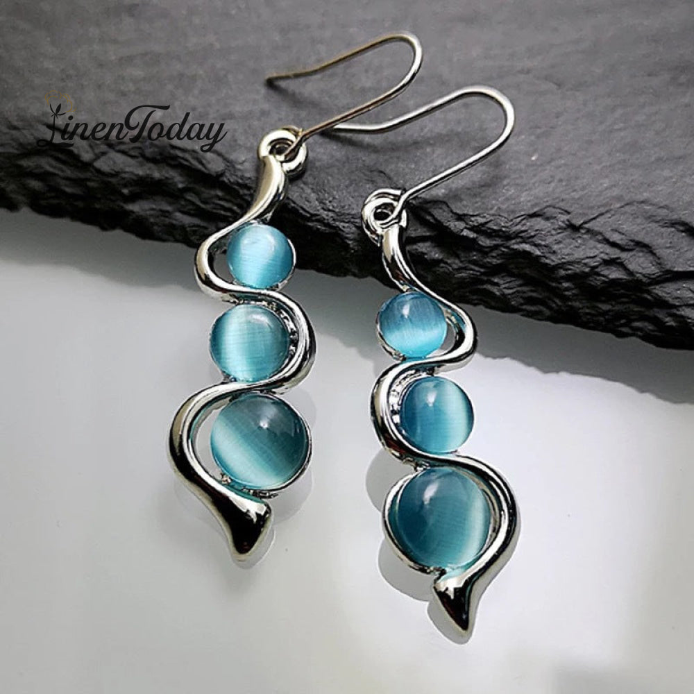Wave Earrings Inlaid With Hyland Cat&rsquo;s Eye Gemstones Light Blue
