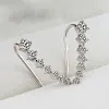 Clous d'oreilles diamant sept &eacute;toiles