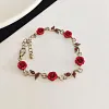 Ensemble de bijoux &eacute;l&eacute;gant avec collier et boucles d'oreilles en forme de fleur de rose